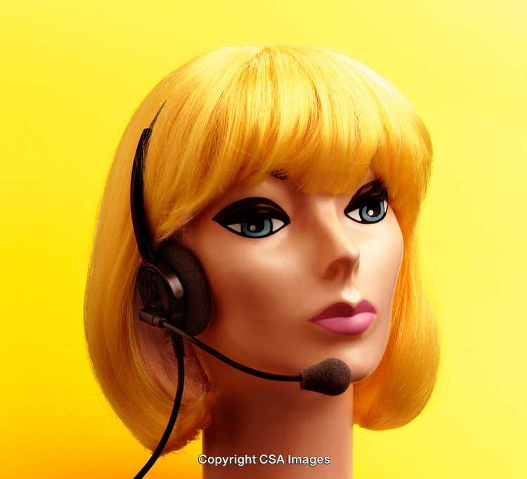Retro Mannequin Headwear Display With Headset Against Bold Yellow Backdrop