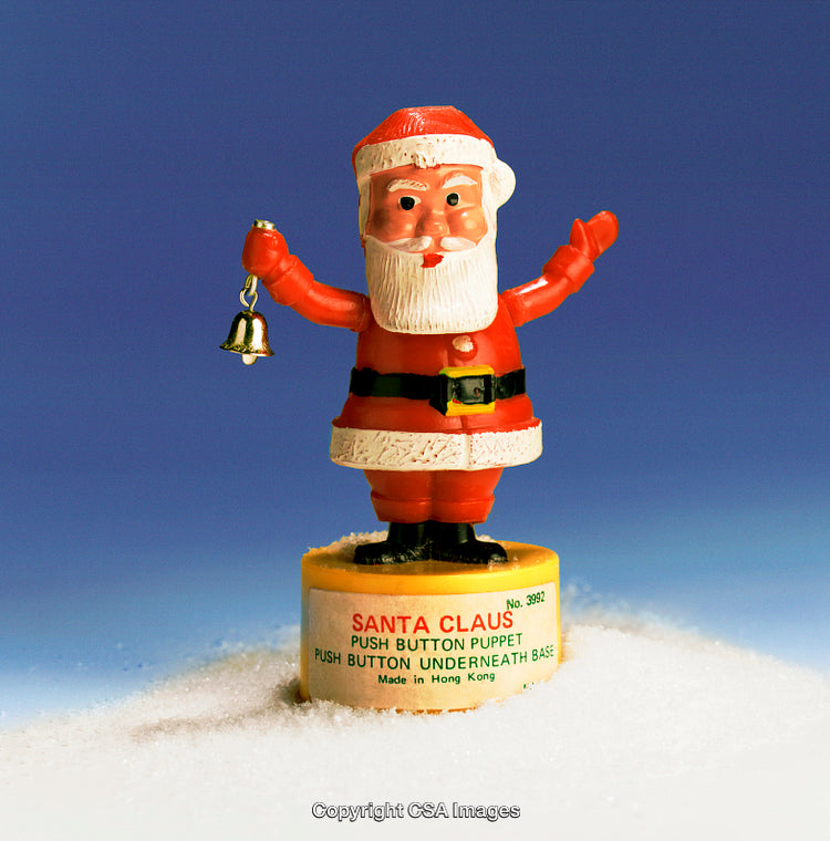 Vintage Santa Claus Plastic Push-Button Toy in Festive Themed Display