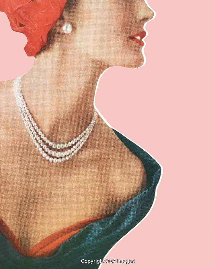 Elegant Woman Wearing Pearls and Red Accessories Against a Pink Backdrop