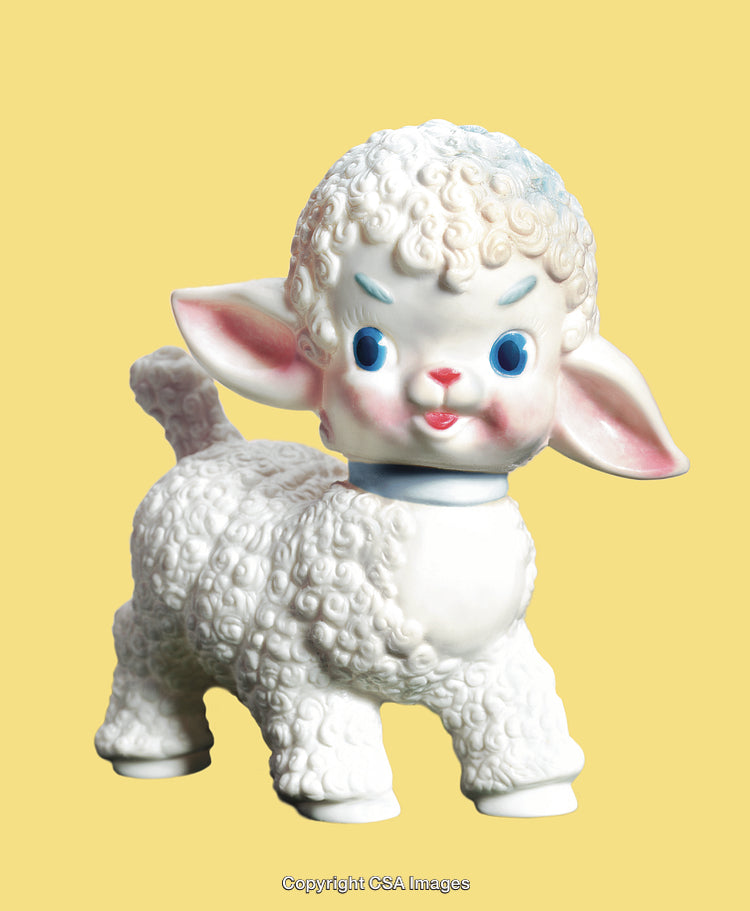 Vintage Porcelain Lamb Figurine With Blue Eyes on Yellow Background