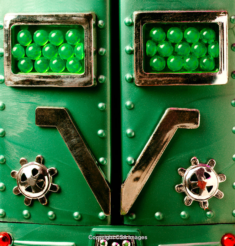 Close-Up of Vintage Green Toy With Gears and Shiny Details