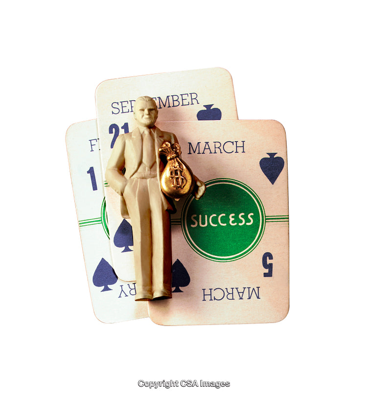 Vintage Figurine on Playing Cards Symbolizing Success and Prosperity