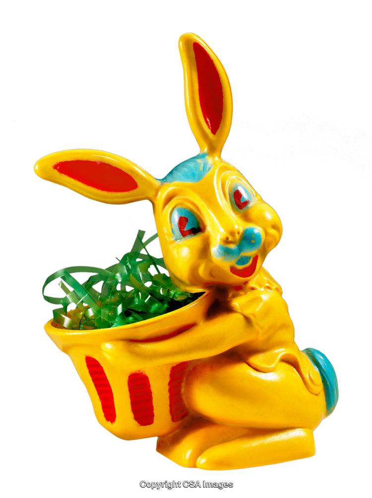 Bright Yellow Easter Bunny Figurine Holding Colorful Basket of Green Easter Grass