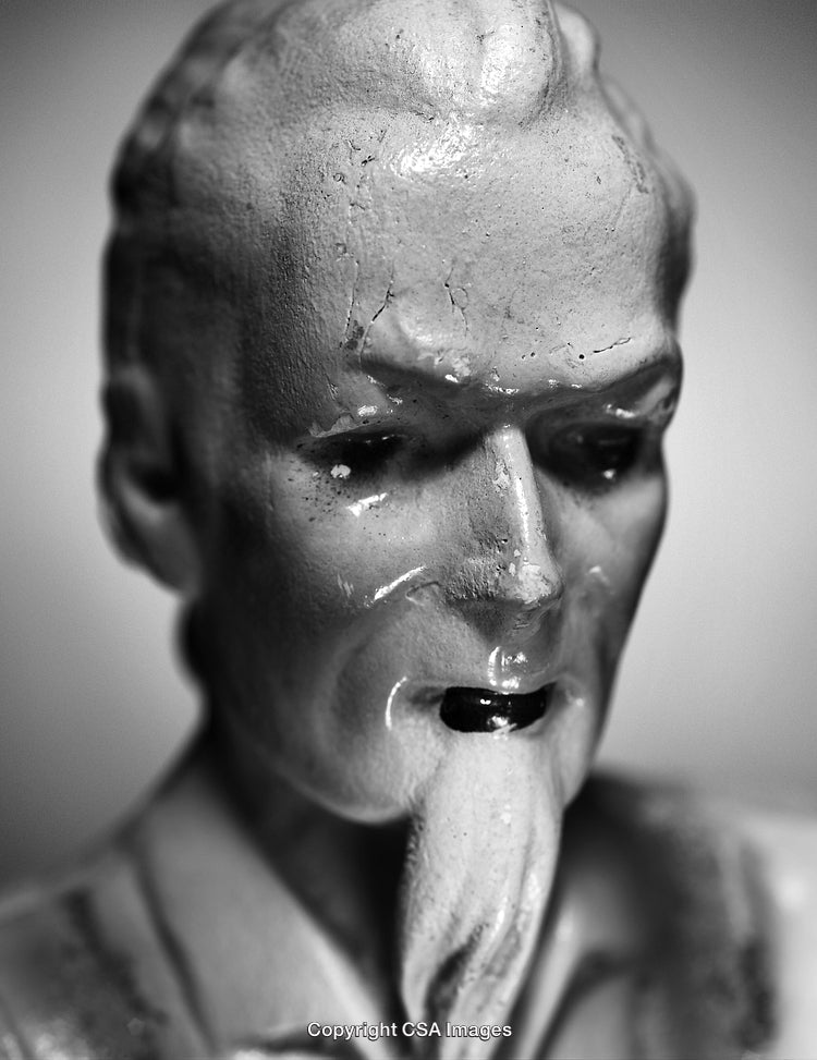 Close-Up of a Vintage Plastic Figurine in Black and White