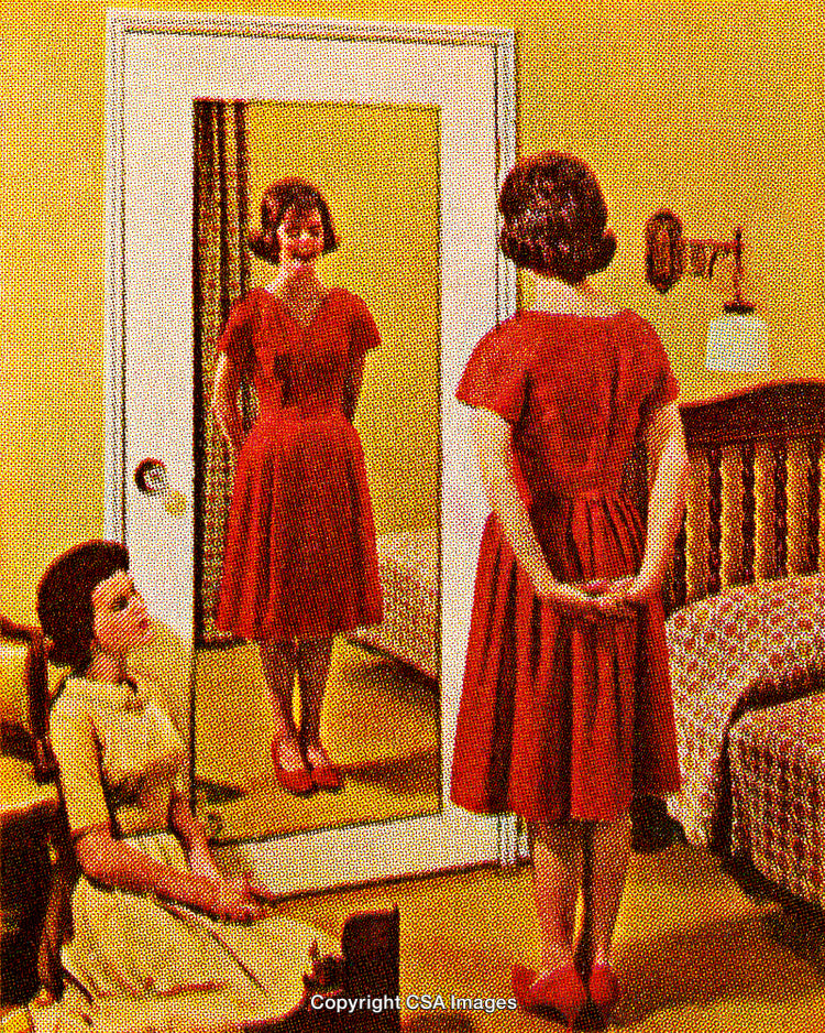 Woman in Red Dress Standing Before Mirror in Vintage Style Image