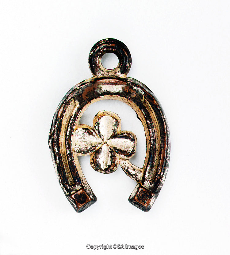 Vintage-Style Horseshoe With Clover Charm, Symbolizing Luck and Fortune