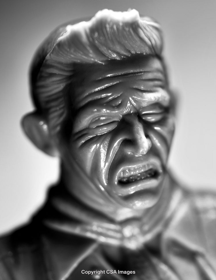 Close-Up of Expressive Plastic Figurine in Dramatic Lighting