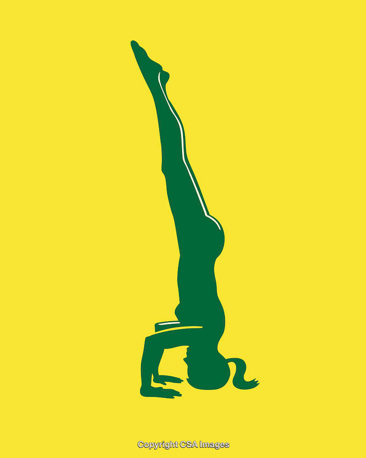 Silhouette of a Person in a Headstand Pose on Yellow Background