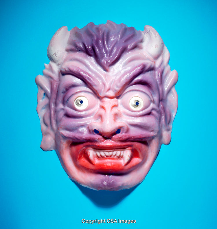 Colorful Monster Face Mask with Expressive Features Against Blue Background
