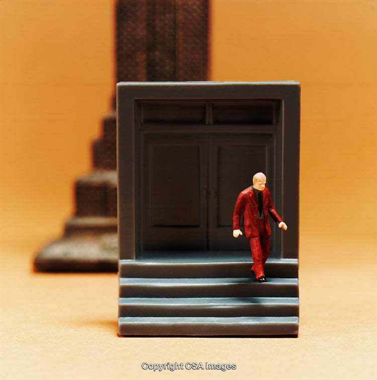 Miniature Businessman Figurine Exiting Building on Bright Background