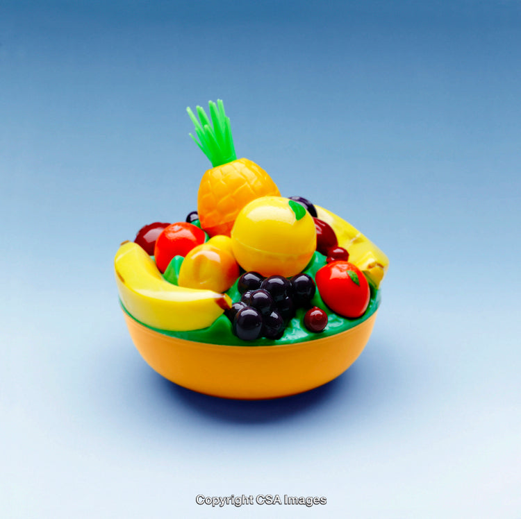Plastic Fruit Bowl with Vibrant Colors on Blue Background