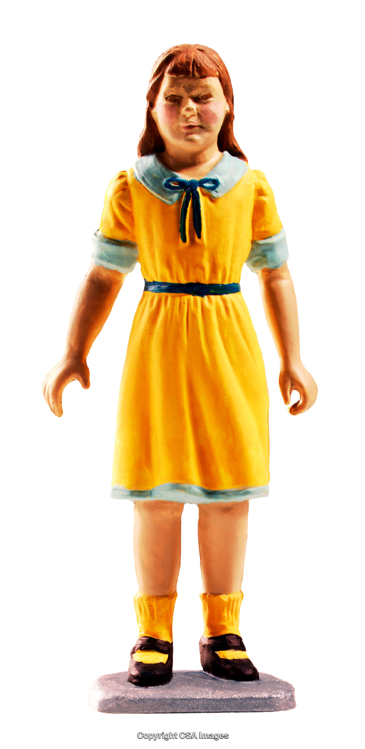 Yellow-Dressed Female Toy Figure with Detailed Features on White Background