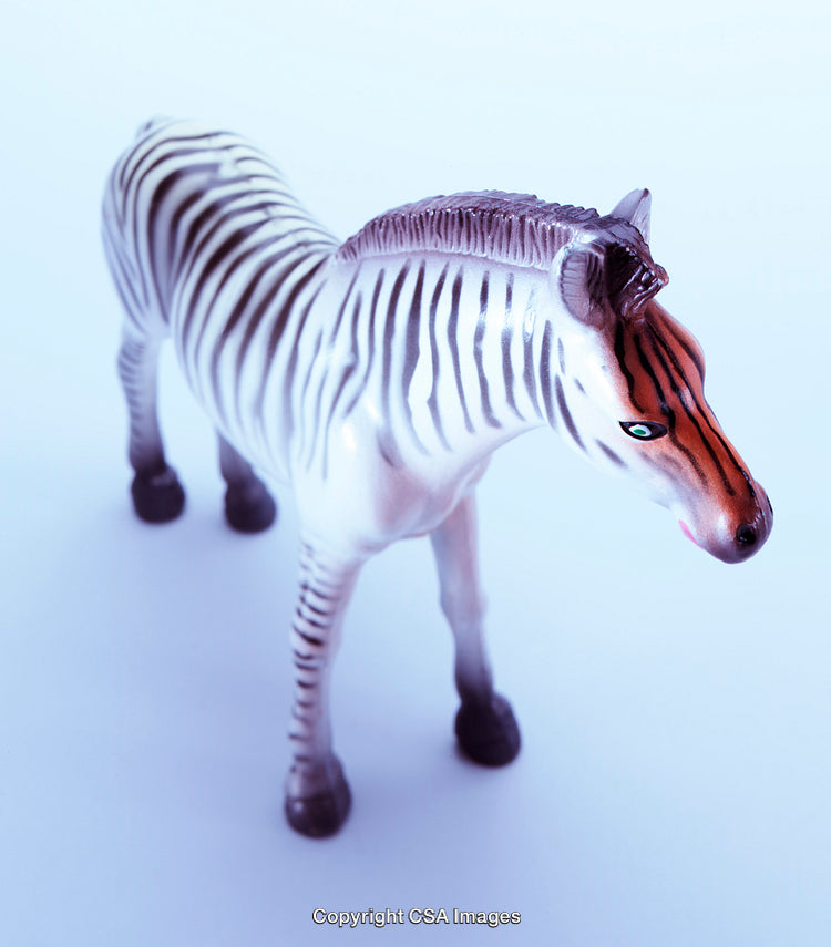 Plastic Toy Zebra Figure on a Light Background