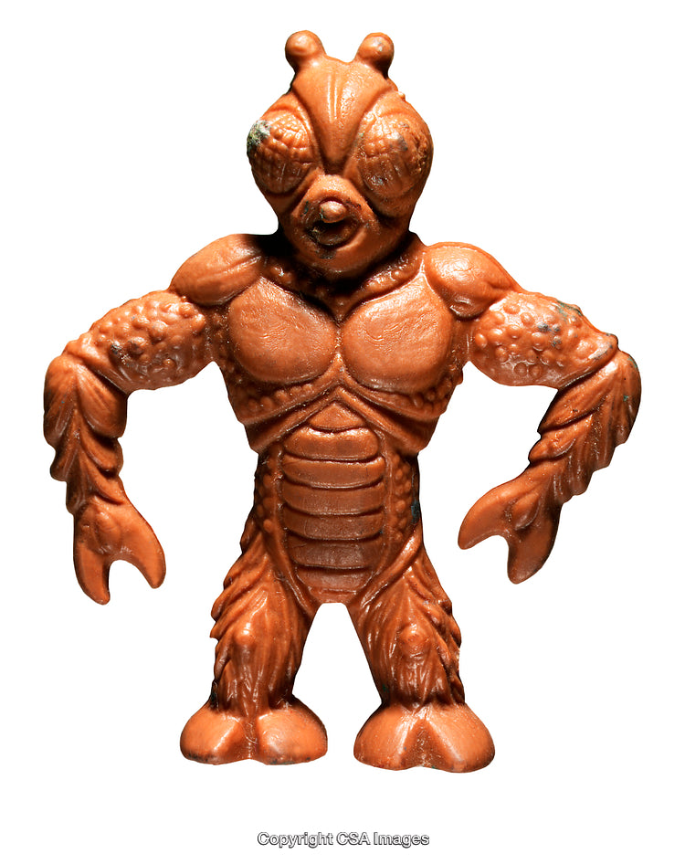 Orange Plastic Monster Toy with Insect Design on White Background