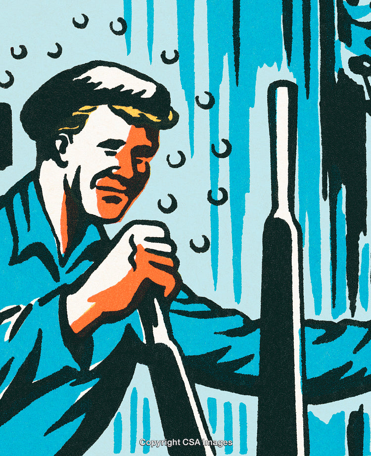 Worker Wearing Overalls Operating Machinery in Industrial Setting with Determined Expression