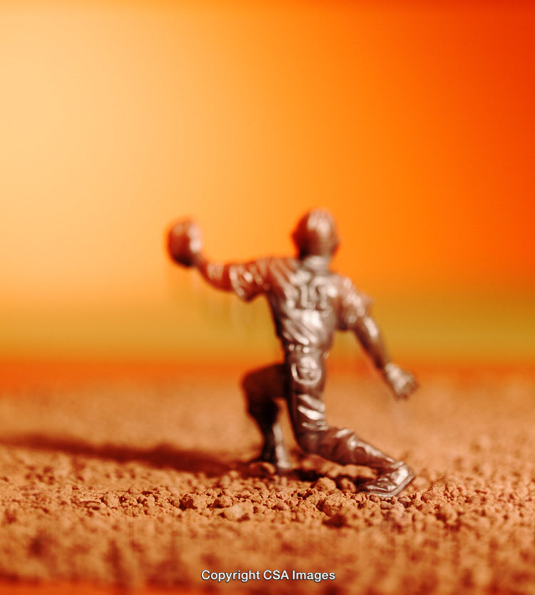 Close-Up of a Plastic Toy Soldier on an Orange Background
