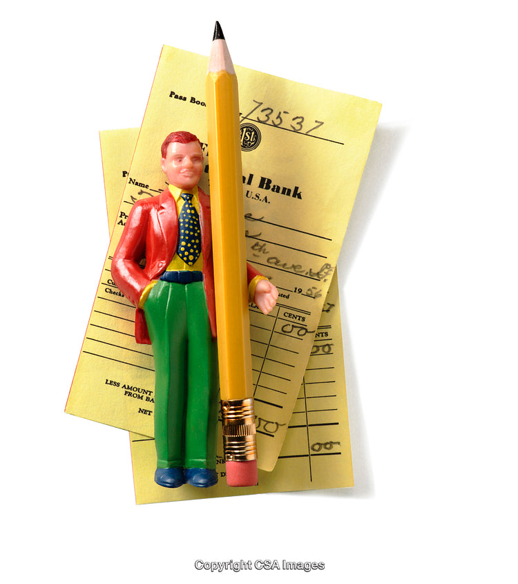 Colorful Figurine and Pencil on Bank Documents