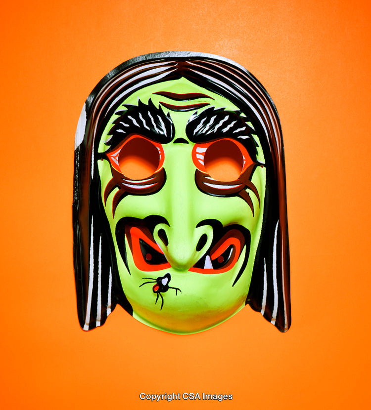 Colorful Witch Mask Against Bright Orange Background for Halloween Decor