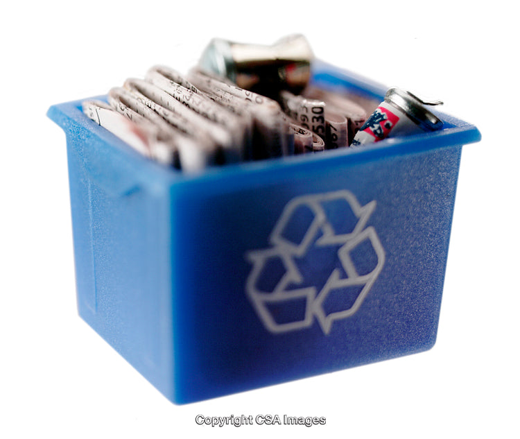 Blue Recycling Bin Filled With Papers and Aluminum Cans, Isolated on White