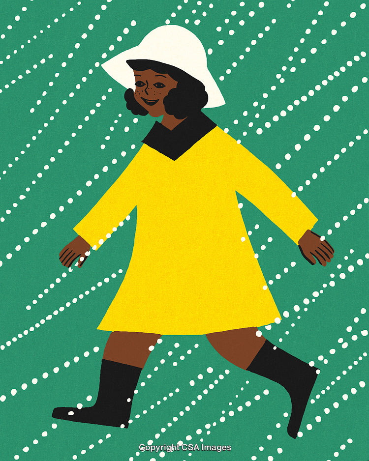 Child in Yellow Raincoat Walking in the Rain With Joyful Expressions