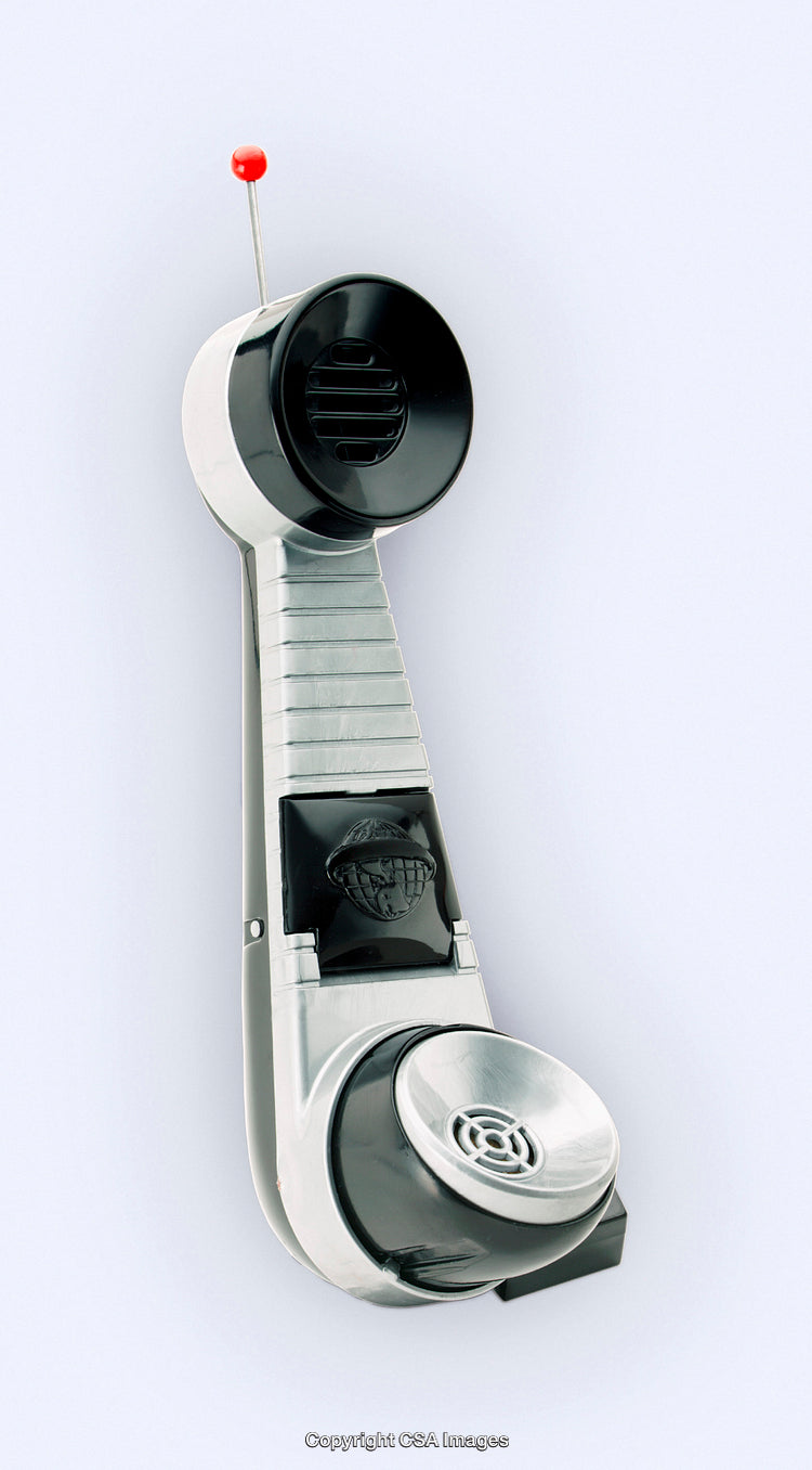 Silver and Black Retro Toy with Antenna Details on White Background