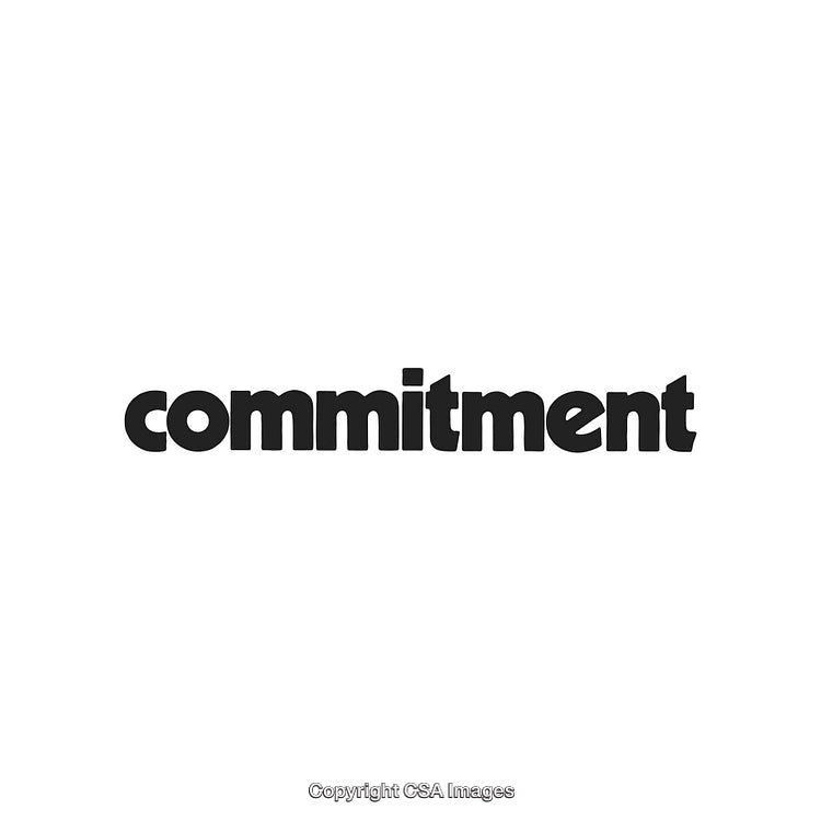 Black Bold Typography of the Word Commitment on a White Background