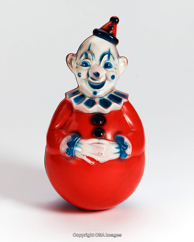 Vintage Red and White Clown Figurine with a Playful Smile