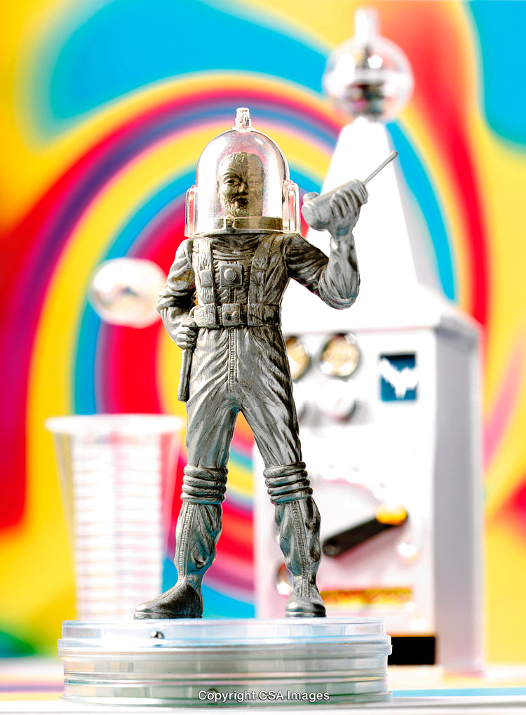 Retro Plastic Astronaut Toy with Colorful Psychedelic Background