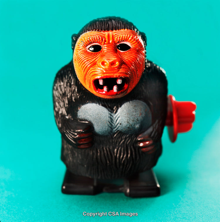 Close-Up of Vintage Toy Monkey with Colorful Background