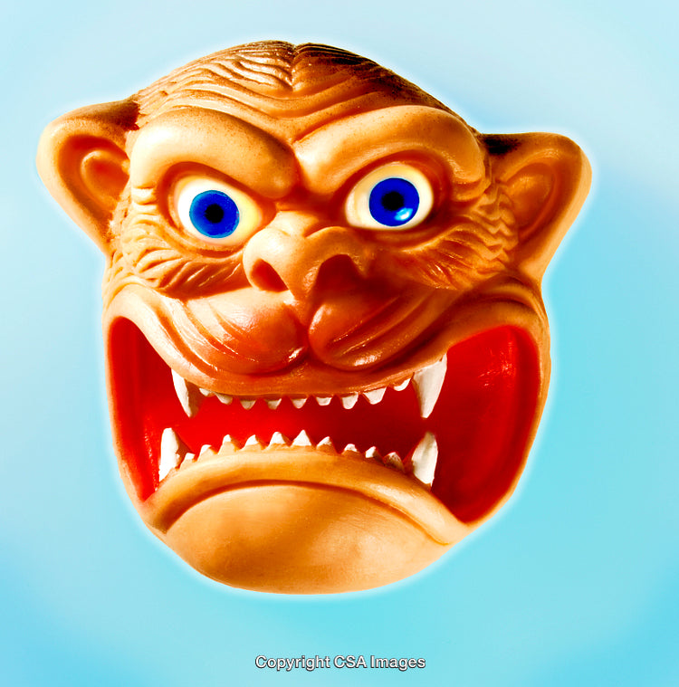 Close-Up of a Fierce Animal-Themed Plastic Toy Mask