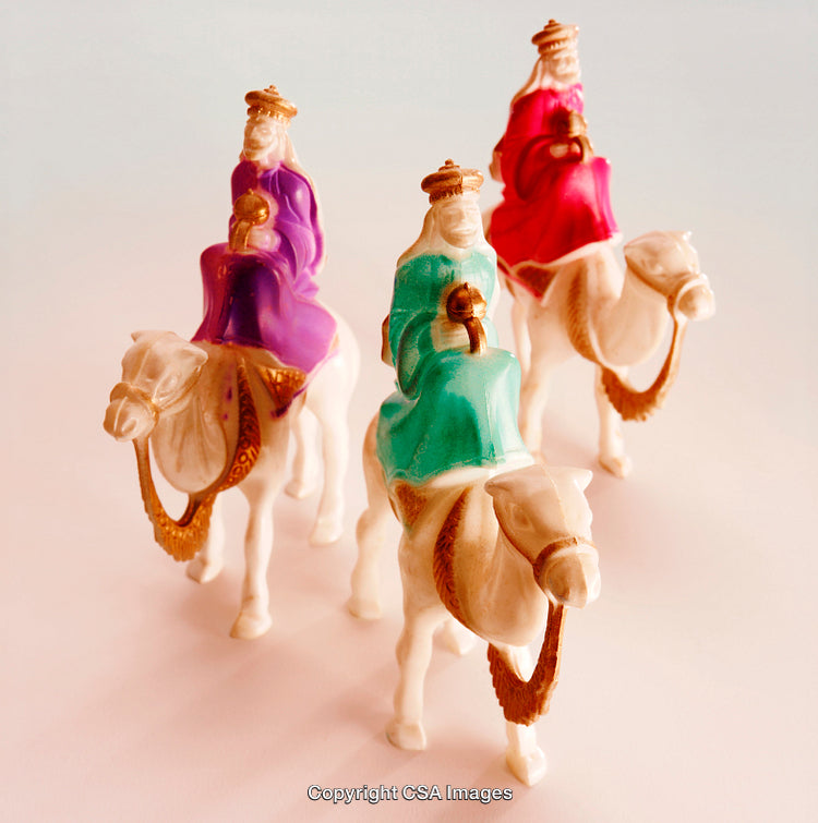 Colorful Toy Figures Depicting Traditional Festive Scene on White Background
