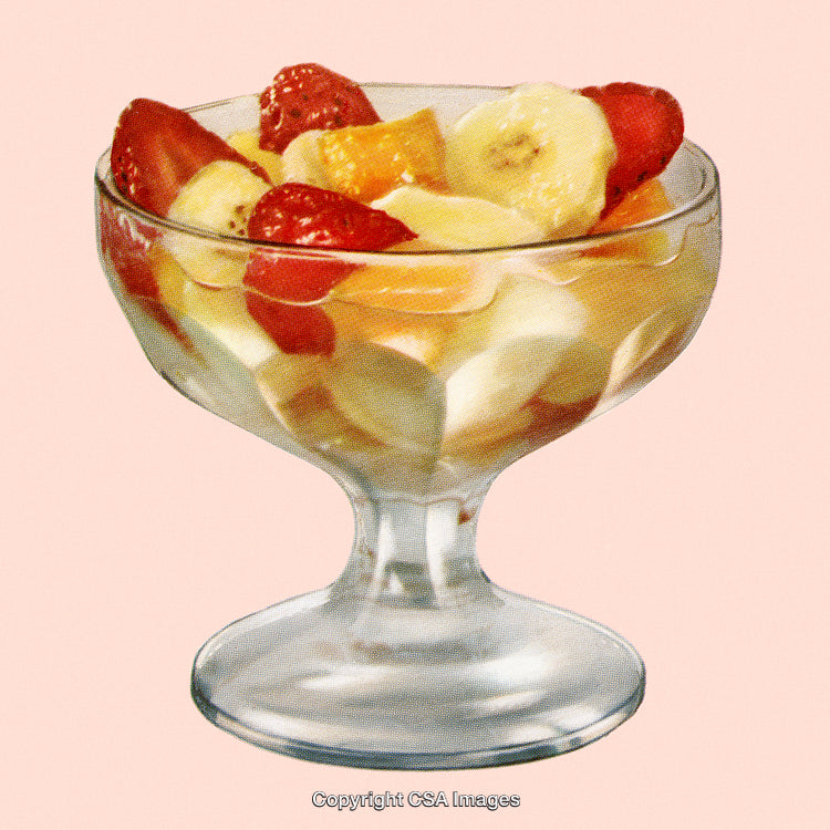 Colorful Fruit Salad in Glass Dish on Pink Background