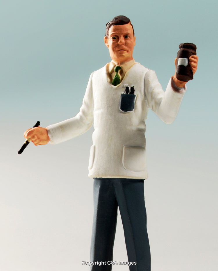 Plastic Figure of a Pharmacist Holding a Medicine Bottle and Pen