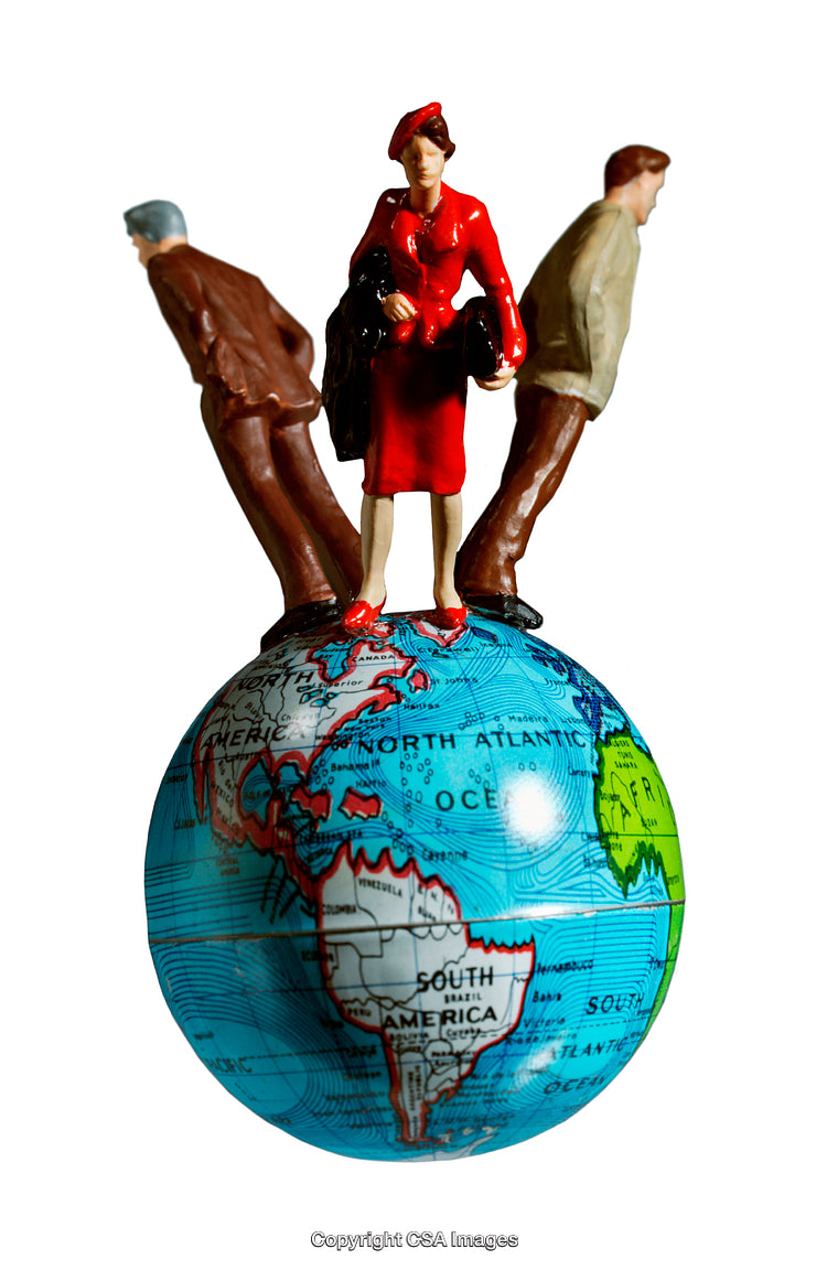 Miniature Figures Around a Globe Depicting Global Collaboration and Diversity