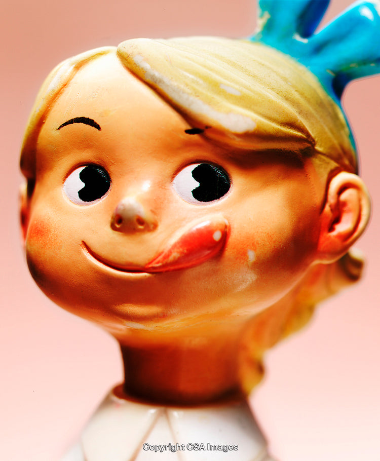 Close-Up of a Cheerful Plastic Figurine with a Cute Expression
