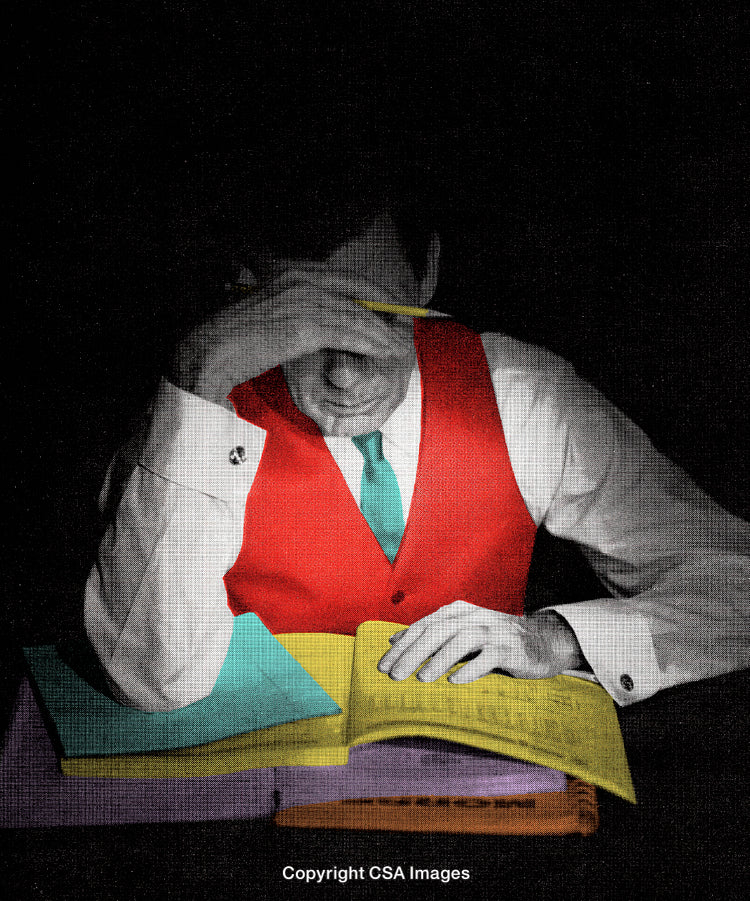 Man Studying Papers Highlighted by Bold Colors Against Dim Background