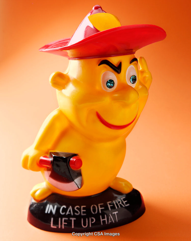 Colorful Cartoon Firefighter Figurine Against Vibrant Orange Background