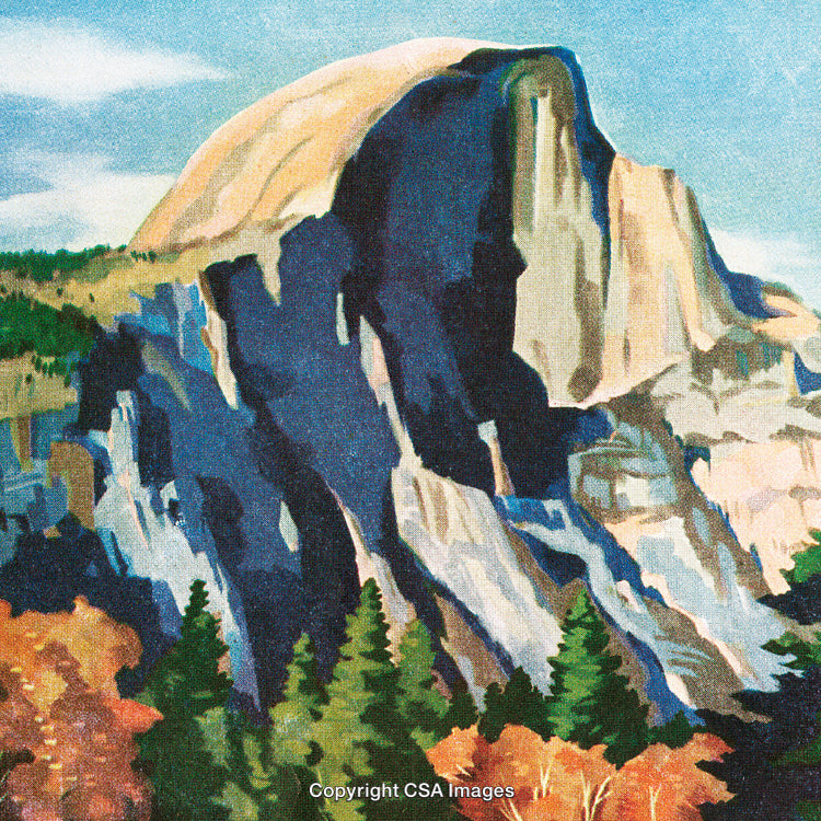 Majestic Rocky Mountain Peak Surrounded by Vibrant Autumn Foliage and Blue Sky