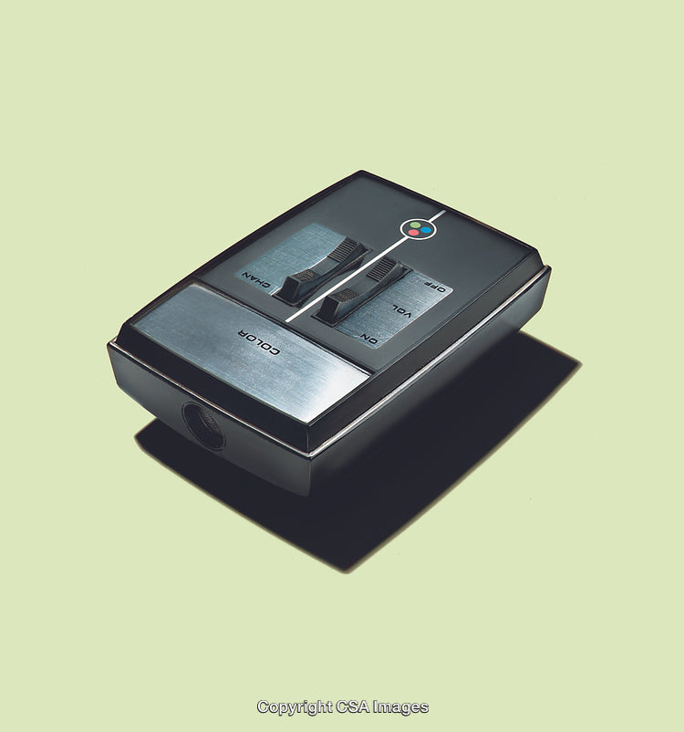 Retro Remote Control Device with Metallic Details on Pastel Background