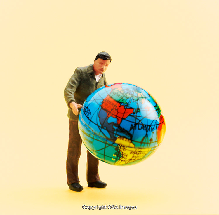 Miniature Figure Examining a Globe Against a Vibrant Yellow Background