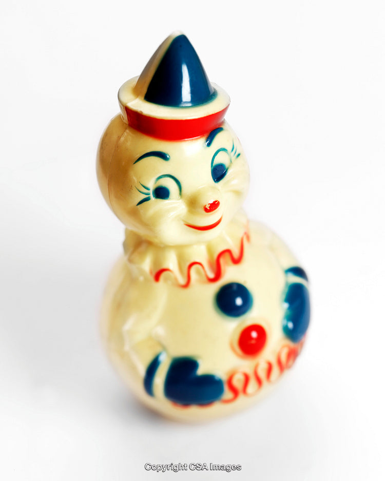Vintage Plastic Clown Toy with Cheerful Expression and Colorful Accents