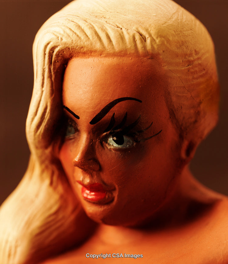 Close-Up of a Blonde Plastic Figurine with Expressive Features