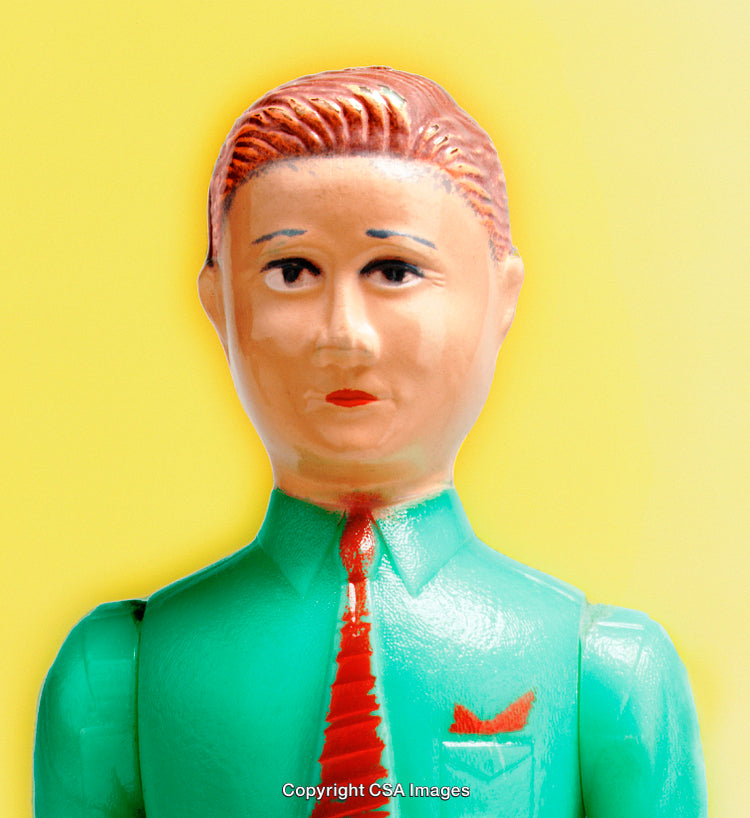 Retro Vintage Plastic Toy Figurine Against a Bright Yellow Background