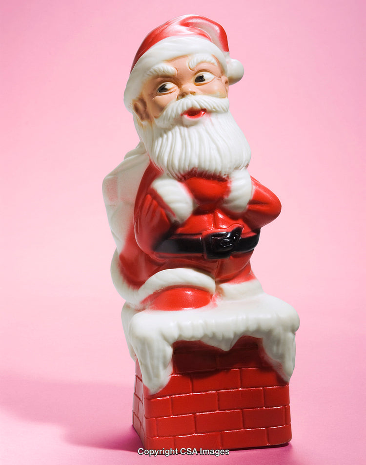 Santa Claus Figurine on Chimney with Bright Pink Background