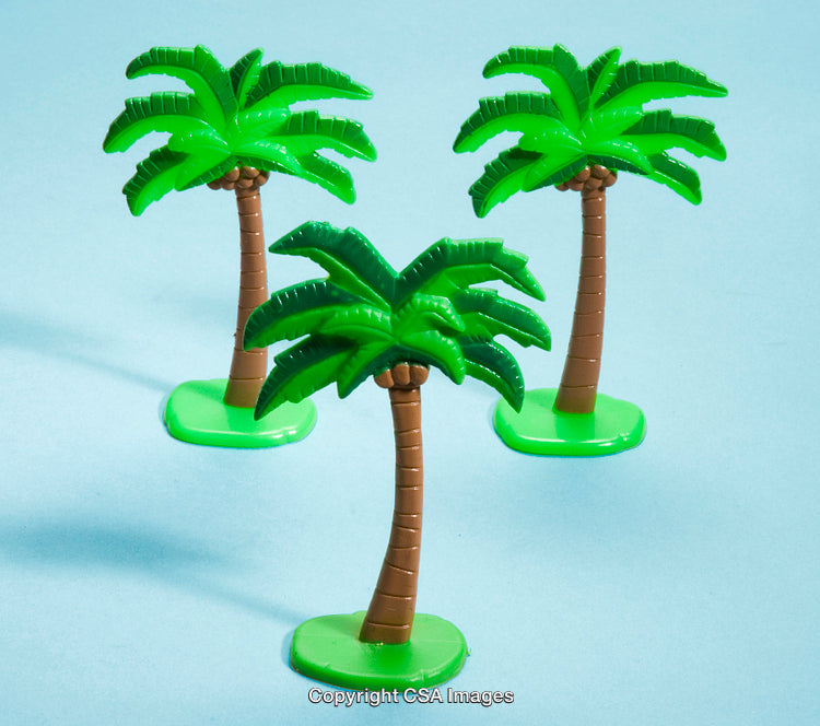 Bright Plastic Palm Trees on a Vibrant Blue Backdrop