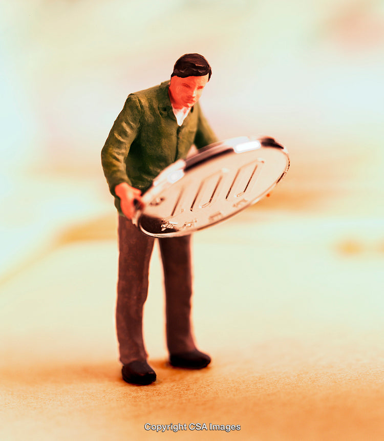 Miniature Figure Holding a Large Coin in a Conceptual Scene