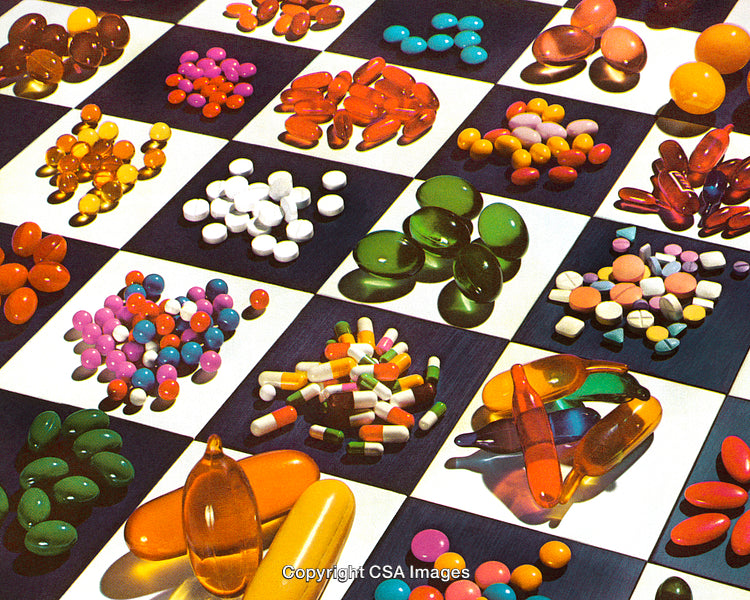Various Colorful Pills and Tablets on a Checkered Surface