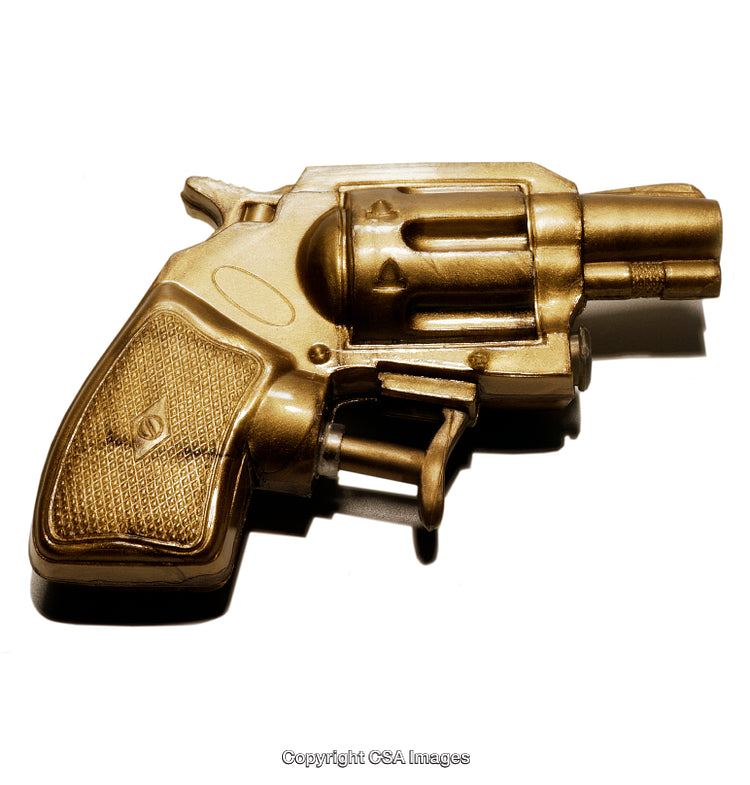 Golden Toy Revolver Isolated on White Background Close-Up