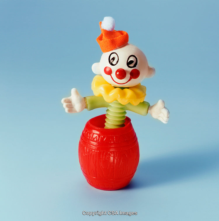 Colourful Jack-in-the-Box Toy Against a Blue Background