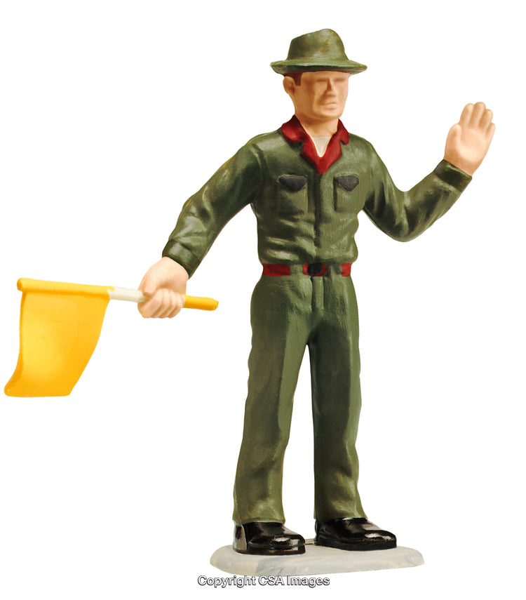 Toy Figurine Dressed in Military Uniform Holding a Yellow Flag
